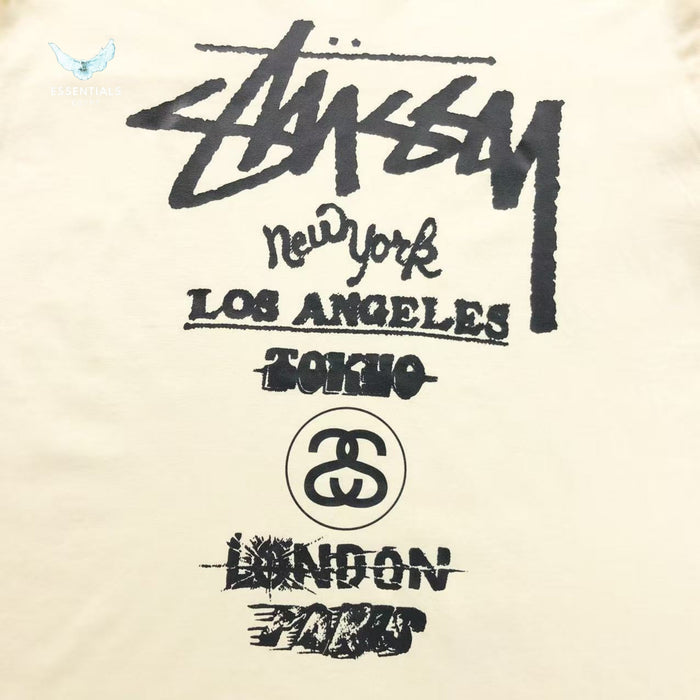Front view of Stussy World Tour long sleeve sweatshirt in cream