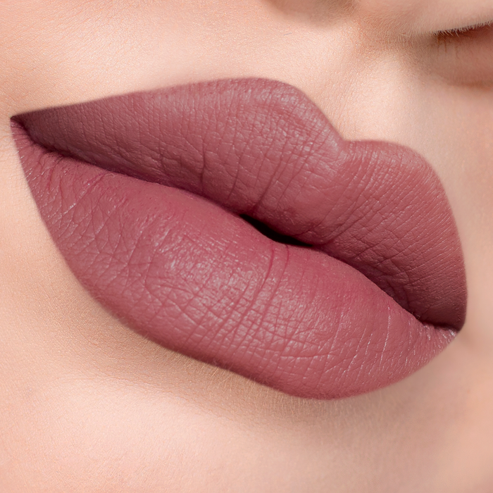 Tell Me More dusty mauve lipstick on lips, light skin tone close-up