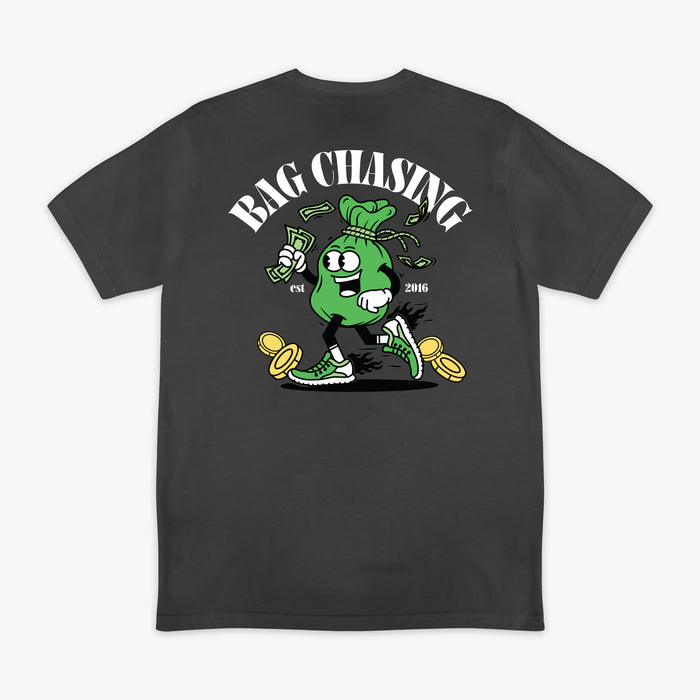 Black t-shirt with a graphic design of a green bag chasing money and 'Bag Chasing' text on a white background