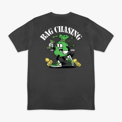 Black t-shirt with a graphic design of a green bag chasing money and 'Bag Chasing' text on a white background