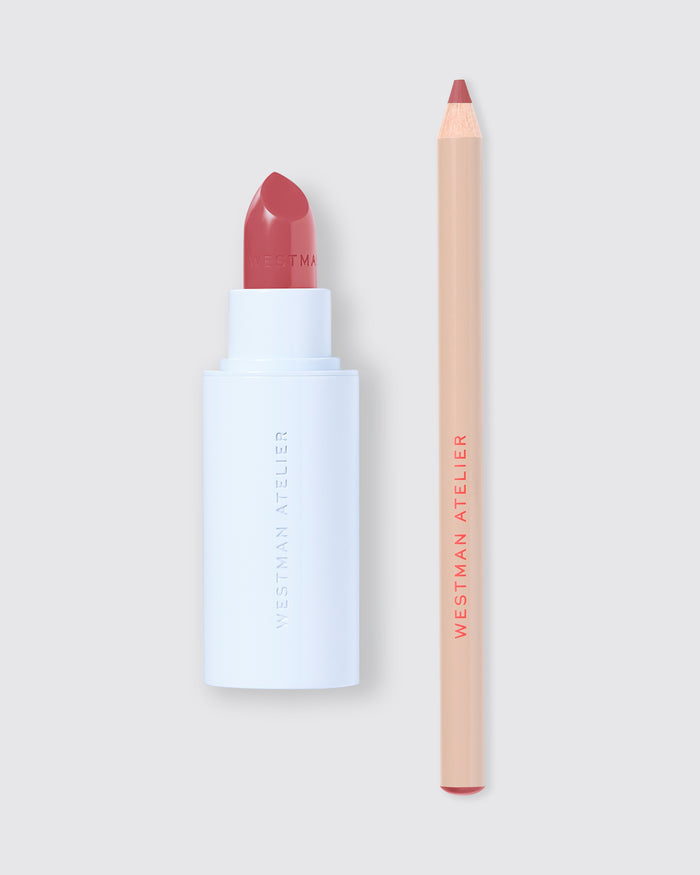 Lipstick and lip pencil with 'Westman Atelier' branding on a light gray background