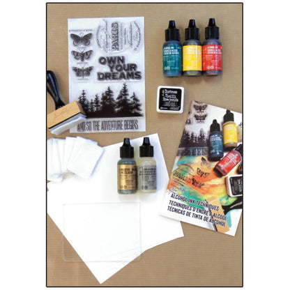 Ranger - Tim Holtz-Alcohol Ink Kit. This kit has everything you need to learn alcohol ink techniques and design your own projects. Follow along with quick and easy tips & techniques, all with step by step instructions. Available at Embellish Away located in Bowmanville Ontario Canada.