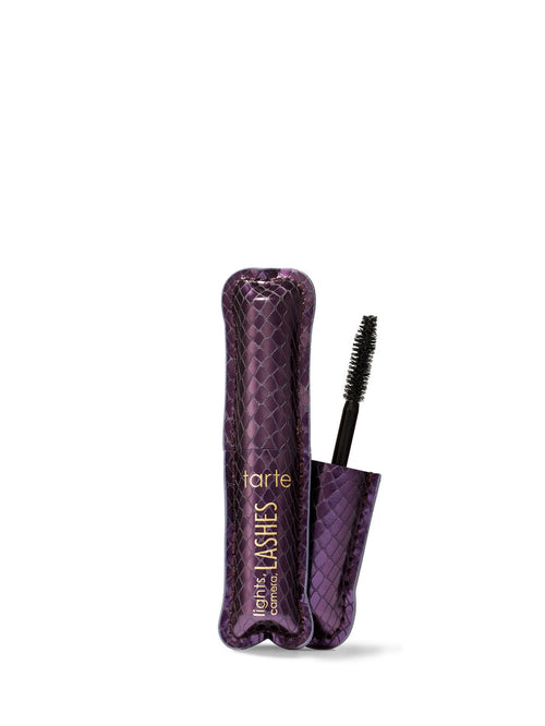 Purple eyelash packaging with brush on white background
