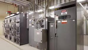 Commercial electrical room with industrial control panels and electrical distribution equipment installed