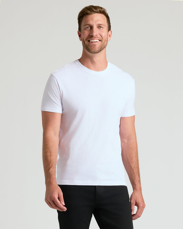 Man wearing All White Crew 10-Pack T-shirt, smiling.