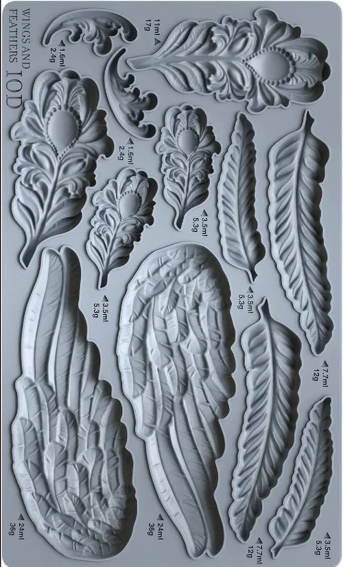 Mold with feather and wing designs on a gray background
