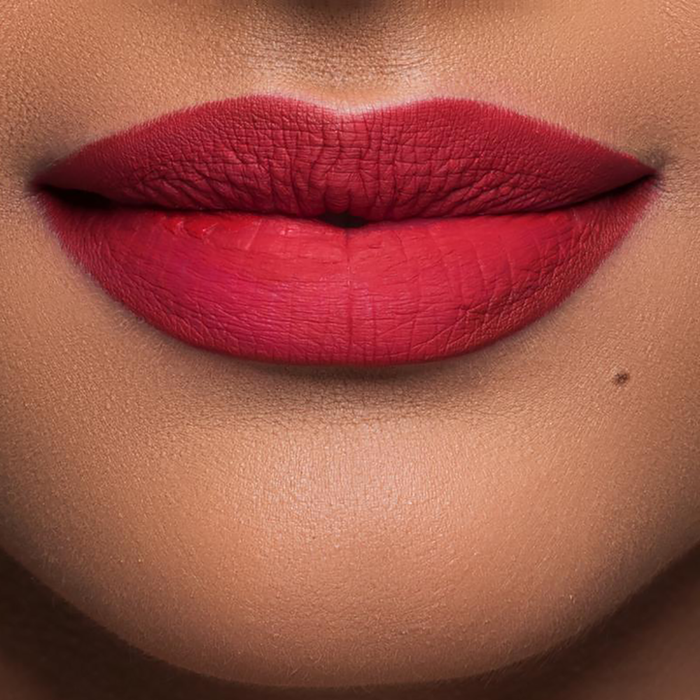Velvet Matte You Red My Mind red lipstick on lips, medium skin tone
